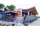 The Killer Burgers Grindhouse exterior shows steps, landscaping, outdoor seating, and colorful painted designs at 901 United Se Ave, Atlanta, GA 30316