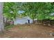 Spacious backyard featuring mature trees and a shed in the distance at 1939 Dunlap Ave, Atlanta, GA 30344