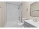 Updated bathroom featuring tub with white tile surround and modern vanity with new faucet at 1939 Dunlap Ave, Atlanta, GA 30344