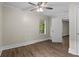 Bedroom featuring hardwood floors, a ceiling fan and a window with a view of the greenery outside at 1939 Dunlap Ave, Atlanta, GA 30344