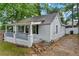 Charming single-story house featuring freshly painted light gray siding and inviting front porch at 1939 Dunlap Ave, Atlanta, GA 30344