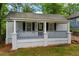 Charming single-story home with a cozy covered porch and freshly painted light gray siding at 1939 Dunlap Ave, Atlanta, GA 30344