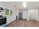 Bright kitchen with stainless appliances, white cabinets and a large stainless refrigerator at 1939 Dunlap Ave, Atlanta, GA 30344