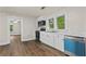 Updated kitchen featuring white cabinets, stainless appliances, and modern vinyl flooring at 1939 Dunlap Ave, Atlanta, GA 30344