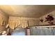 Dated bathroom with striped wallpaper, shower curtain, and older fixtures at 2234 Glendale Dr, Decatur, GA 30032