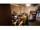 Bedroom with a desk covered in clutter, a small wardrobe, and untidy floors at 2234 Glendale Dr, Decatur, GA 30032