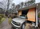View of the carport, with vehicle parked and covered with fabric at 2234 Glendale Dr, Decatur, GA 30032
