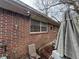 Exterior shot showing the brick siding, windows, and chairs at 2234 Glendale Dr, Decatur, GA 30032
