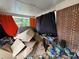 Overcrowded garage interior needs serious decluttering and organization at 2234 Glendale Dr, Decatur, GA 30032
