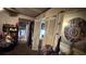 Hallway with view into kitchen; displays white folding doors and cluttered surfaces at 2234 Glendale Dr, Decatur, GA 30032