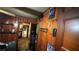 Hallway with wood paneling and multiple doorways, displaying various decorations on the walls at 2234 Glendale Dr, Decatur, GA 30032
