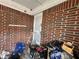 Porch area shows brick wall, screen door, and assorted storage items and clutter at 2234 Glendale Dr, Decatur, GA 30032