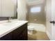 Well-lit bathroom with a sleek vanity, modern fixtures, and a shower-tub combination at 2419 Boulder Se Rd, Atlanta, GA 30316