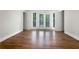 Bedroom featuring hardwood floors, neutral walls, and a juliet balcony at 2419 Boulder Se Rd, Atlanta, GA 30316