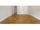 Neutral bedroom with hardwood floors, white trim, and a window at 2419 Boulder Se Rd, Atlanta, GA 30316