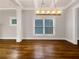 Bright dining room with hardwood floors, a modern chandelier, and large windows offering abundant natural light at 2419 Boulder Se Rd, Atlanta, GA 30316