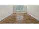 Empty room featuring a large window and hardwood floors, awaiting personal touch to transform it into a personalized space at 2419 Boulder Se Rd, Atlanta, GA 30316