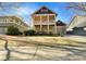 Charming two-story home with a welcoming front porch, showcasing a blend of modern design and classic architectural details at 2419 Boulder Se Rd, Atlanta, GA 30316