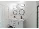 Bright bathroom featuring dual vanities, black fixtures, and modern lighting at 4011 Redan Rd # 7, Stone Mountain, GA 30083