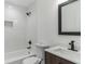 Stylish bathroom features subway tiles, a soaking tub, and modern vanity at 4011 Redan Rd # 7, Stone Mountain, GA 30083
