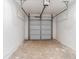 Spacious two car garage featuring a garage door opener and concrete floor at 4011 Redan Rd # 7, Stone Mountain, GA 30083