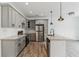 Modern kitchen with gray cabinets, stainless steel appliances, and granite countertops at 4011 Redan Rd # 7, Stone Mountain, GA 30083