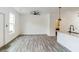 Bright living room open to kitchen and featuring stylish flooring and modern ceiling fan at 4011 Redan Rd # 7, Stone Mountain, GA 30083