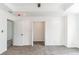 Spacious main bedroom featuring a tray ceiling, ceiling fan, carpet flooring and walk-in closet at 4011 Redan Rd # 7, Stone Mountain, GA 30083