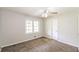 Cozy bedroom featuring a ceiling fan, double-hung window and neutral paint at 263 Austin Rd, Stockbridge, GA 30281