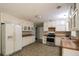 Functional kitchen featuring ample cabinetry, stainless steel appliances, and a double sink at 263 Austin Rd, Stockbridge, GA 30281