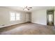 Spacious living room with neutral walls and carpet flooring ready for your personal touches at 263 Austin Rd, Stockbridge, GA 30281