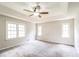 Spacious main bedroom with tray ceiling and a ceiling fan at 263 Austin Rd, Stockbridge, GA 30281