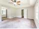 Spacious main bedroom with ceiling fan and ensuite bathroom access at 263 Austin Rd, Stockbridge, GA 30281
