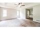 Large main bedroom featuring neutral paint, carpeted floors and ensuite bath at 263 Austin Rd, Stockbridge, GA 30281