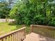 Back deck with green scenery in the background at 3838 Glenlake Springs Nw Ct, Kennesaw, GA 30144