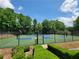 Recreational basketball court with hoops and lush landscaping at 3838 Glenlake Springs Nw Ct, Kennesaw, GA 30144