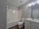 Well-lit bathroom with modern vanity and shower-tub combination at 3838 Glenlake Springs Nw Ct, Kennesaw, GA 30144