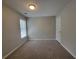 Cozy bedroom with plush carpet, white trim, and bright window at 3838 Glenlake Springs Nw Ct, Kennesaw, GA 30144