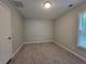 Bedroom with plush carpet, neutral walls, and a sunny window at 3838 Glenlake Springs Nw Ct, Kennesaw, GA 30144