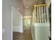 Inviting entryway with wood-look floors, a staircase, and a view into the living room at 3838 Glenlake Springs Nw Ct, Kennesaw, GA 30144