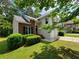 Charming two-story home featuring a brick accent, well-manicured lawn, and a two-car garage at 3838 Glenlake Springs Nw Ct, Kennesaw, GA 30144