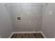 Utility room features laundry hook-ups and modern flooring at 3838 Glenlake Springs Nw Ct, Kennesaw, GA 30144