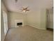 Comfortable living room featuring a fireplace, carpeted floors, and neutral paint at 3838 Glenlake Springs Nw Ct, Kennesaw, GA 30144