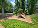 A wooden playground creates a fun, safe space for to play outdoors in the community at 3838 Glenlake Springs Nw Ct, Kennesaw, GA 30144