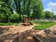 A community playground provides a fun space for families to spend time outdoors and stay active at 3838 Glenlake Springs Nw Ct, Kennesaw, GA 30144