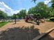 A colorful playground swing set provides a great space for to play together in the neighborhood at 3838 Glenlake Springs Nw Ct, Kennesaw, GA 30144