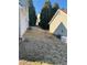 View of the backyard showing ample space and a generator at 4874 Larkspur Ln, Atlanta, GA 30349