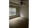 Bedroom with a ceiling fan and a large window for natural light at 4874 Larkspur Ln, Atlanta, GA 30349