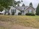 Charming single-story home with stone accents, manicured lawn, and inviting curb appeal at 4874 Larkspur Ln, Atlanta, GA 30349