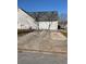 Spacious two-car garage with a long driveway for extra parking at 4874 Larkspur Ln, Atlanta, GA 30349